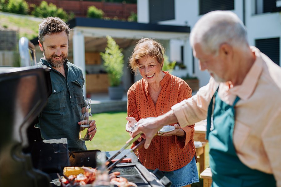 Family grilling during in the backyard